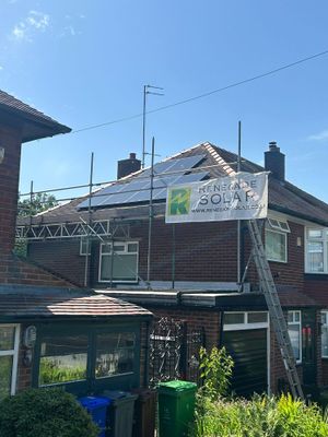 Renegade Solar panel installation on a tiled roof with branded scaffold banner